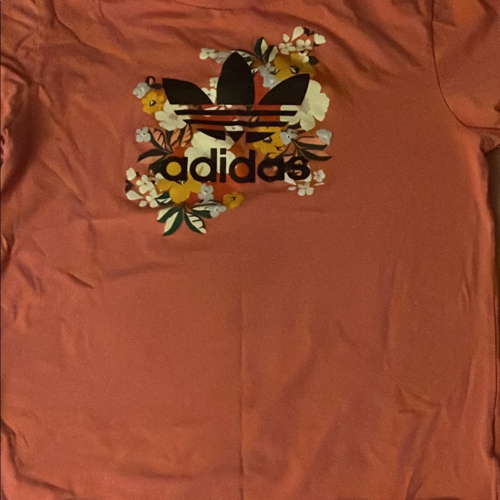 Adidas pink shirt with flowers on it